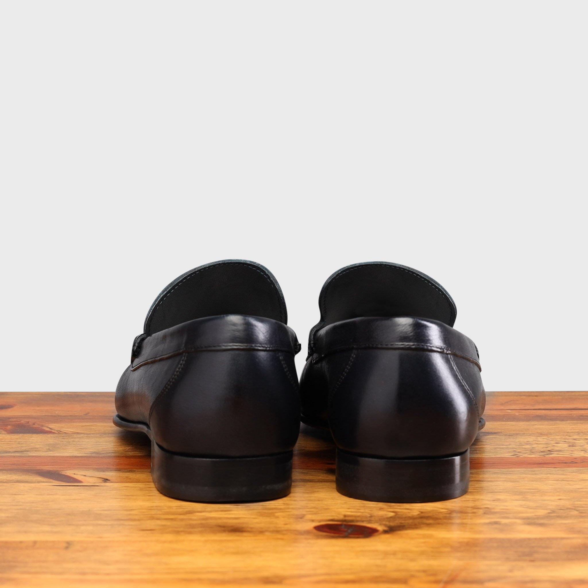 Back profile of 8616-M Calzoleria Toscana Blue Buff Calf Slip-On on top of a wooden table